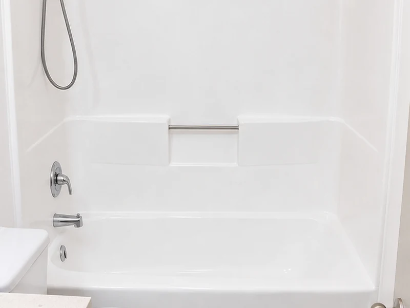 Refinished glossy white fiberglass tub-shower combo in an Oakland apartment bathroom